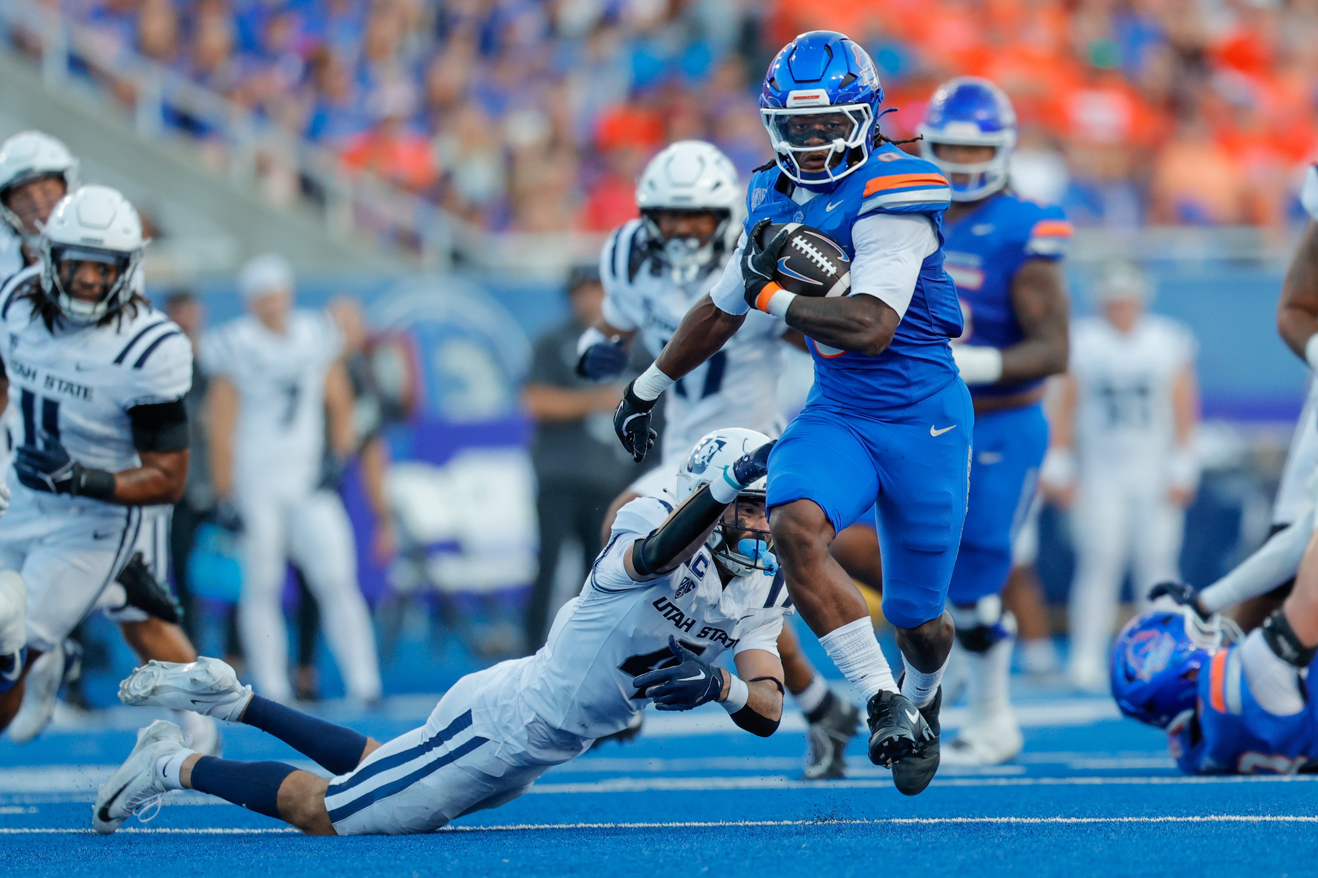 Madsen, No. 22 Boise State beat Utah State 37-18 in the teams' inaugural Pac-12 game