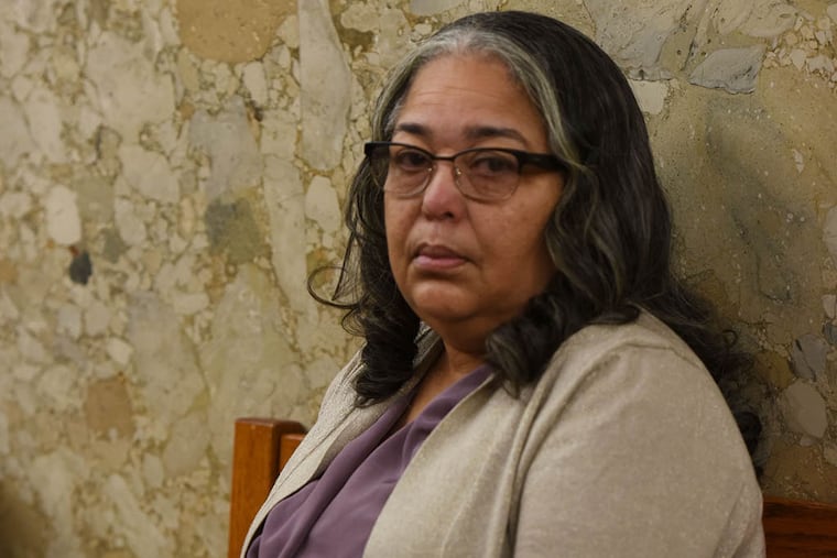 Pennsylvania State Rep. Michelle Brownlee sits outside the courtroom at the Dauphin County courthouse on June 8, 2015, in Harrisburg, Pa. ( Philadelphia Inquirer / Bradley C Bower )