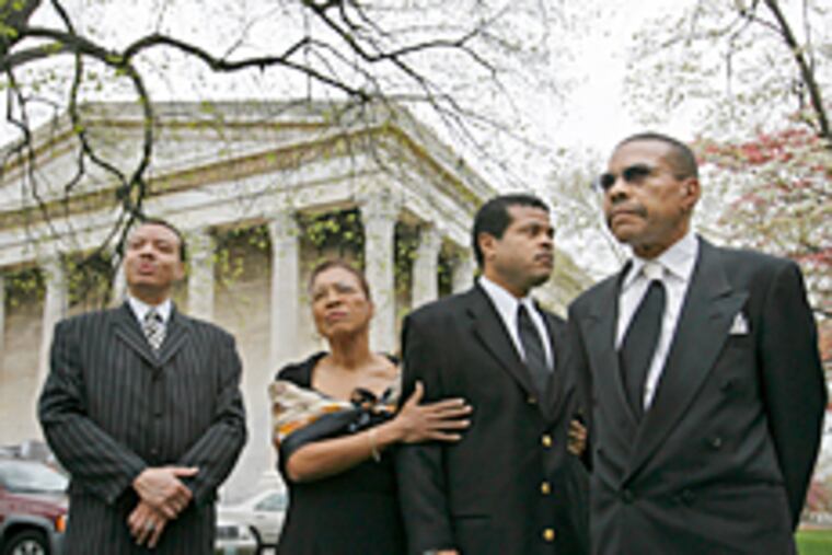 Marie Hicks' children, from left, Charles Hicks, Loretta Hicks Mason, Theodore Hicks and Junius Hicks, gather this afternoon at Girard College for a family luncheon after the funeral for their mother.