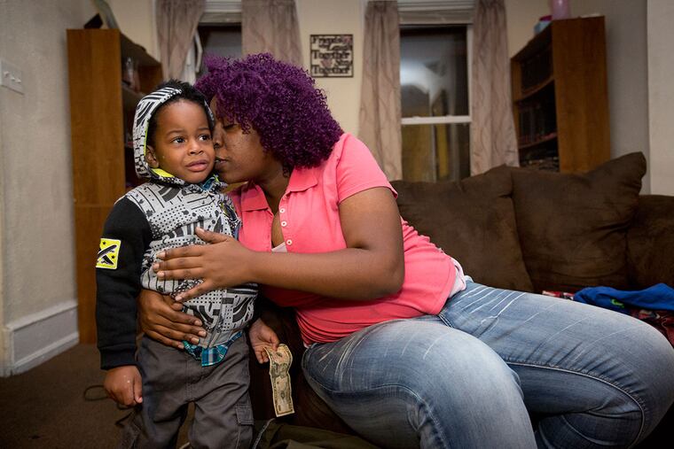 Sophia Pope comforts her son Vaughn before bringing him over to her mother's house. Pope and her husband Gregory Jackson sent their children to stay at her mother's home after they realized their former rental house was filled with toxic lead.