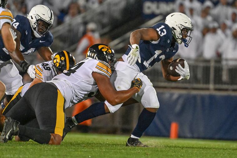 Penn State running back Kaytron Allen (13) runs against Iowa during the first half Saturday.
