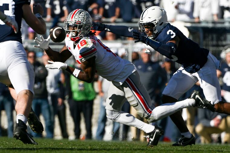 Ohio State wide receiver Marvin Harrison Jr., a former St. Joseph's Prep star, makes a catch in front of Penn State cornerback Johnny Dixon on Saturday.