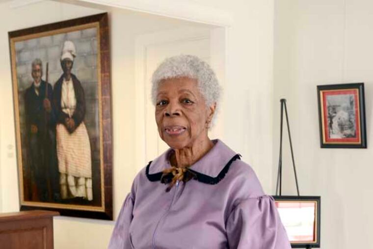 Louise Calloway, founder of the Railroad Museum of Burlington County and a Historical interpreter poses in the museum's temporary exhibit space in the Welcome Center of Smithville March 7, 2014. Smithville is the gem of the Burlington County Parks System and helps tell the story of the county. But the history of African Americans hasn't had a significant presence there. That exhibit will be expanded to fill two refurbished and connected workers’ houses within about a year. ( TOM GRALISH / Staff Photographer )