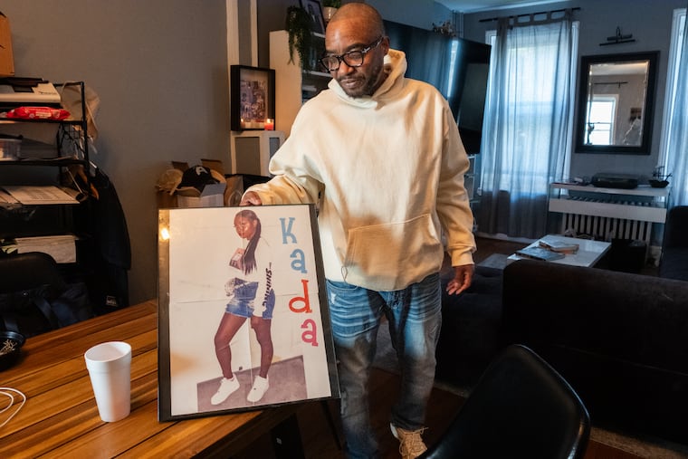 Kevin Scott, Kada Scott’s father, with a photo of his daughter.