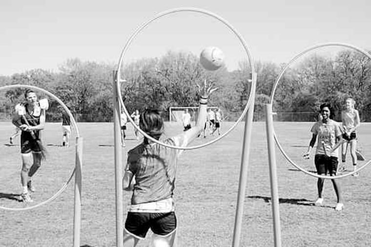 Allison Moore blocks a shot by AJ Jordan during their game of Quidditch in Grapevine, Texas. Players mount up on dust mops, push brooms, classic corn brooms, craft-store twig brooms, even feather dusters.