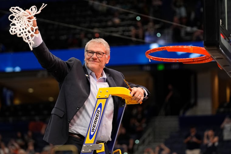 UConn coach Geno Auriemma cuts down the net in Tampa, Fla., after the victory over South Carolina in the national championship game.