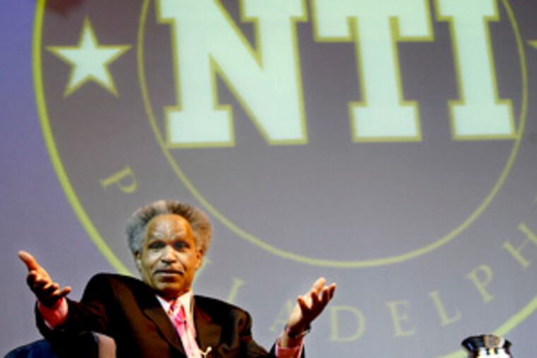 Street touting neighborhood initiative in '05. Critics say he gives the program too much credit for lifting the real estate atmosphere.