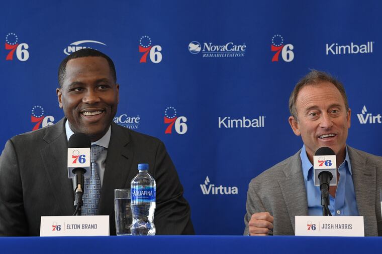 Sixers owner Josh Harris, right, introduces Elton Brand as the team's new general manager Thursday.