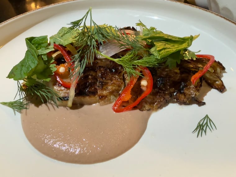 The seared savoy cabbage, part of Uchi's $83 vegetable omakase, which includes 10 courses.