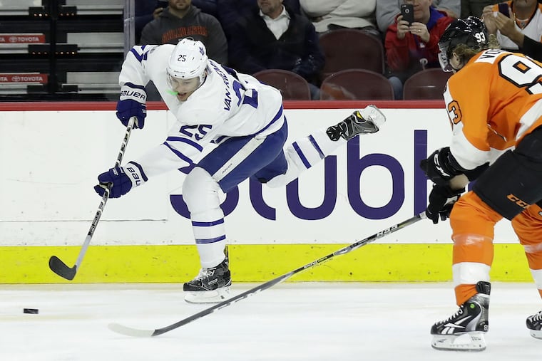 Toronto Maple Leafs left winger James van Riemsdyk passes the puck past Flyers right winger Jake Voracek. Voracek was one of the players who helped the player they call JVR to return to the Flyers.