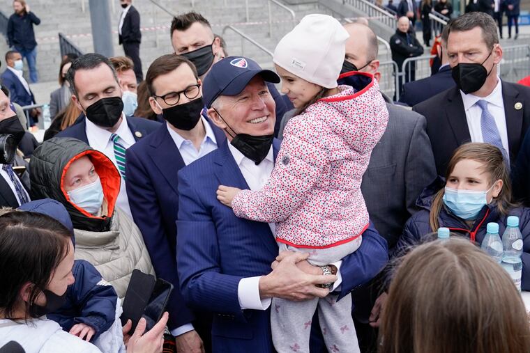 President Joe Biden meets with Ukrainian refugees during a visit to PGE Narodowy Stadium, March 26, 2022, in Warsaw. The Biden administration is making it easier for refugees fleeing Russia’s war on Ukraine to come to the United States from Europe while trying to shut down an informal route through Northern Mexico that has emerged in recent weeks.