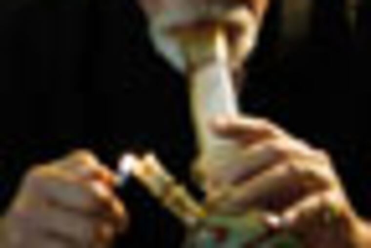 Lonnie Painter, 65, who uses marijuana for medicinal purposes and is the director of a group known as Laguna Woods for Medical Cannabis, medicates at his home in Laguna Woods, Calif., Monday, May 9, 2011. (AP Photo/Reed Saxon)