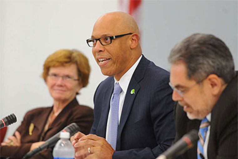 William R. Hite Jr., Philadelphia's new school superintendent, addresses his first SRC meeting as members Feather O. Houstoun and Pedro Ramos listen. (Clem Murray / Staff Photographer)