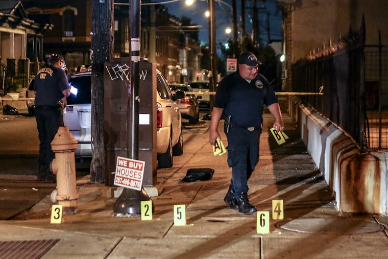 Crime scene police officers investigate a shooting at 11th Street and Lehigh Avenue where two 15-year-old males were shot, Monday, Sept. 13, 2021.