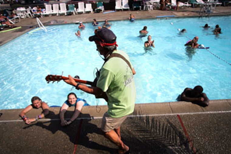 John "Billy Jack" Gunther keeps company with bathers, fans, and the same old songs of Thorogood, Buffett, Animals, Steppenwolf. (David Swanson / Staff Photographer)