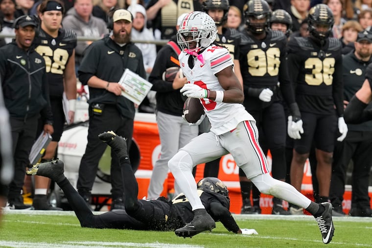 Ohio State wide receiver Marvin Harrison Jr. runs past Purdue's Will Heldt during the first half Saturday. Harrison and the third-ranked Buckeyes will host No. 7 Penn State this Saturday.