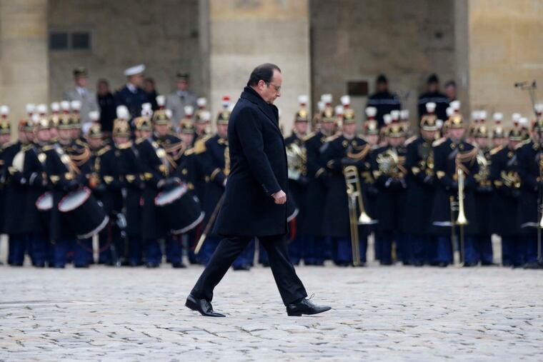 French President Francois Hollande attends a ceremony in the courtyard of Paris' Invalides national monument.