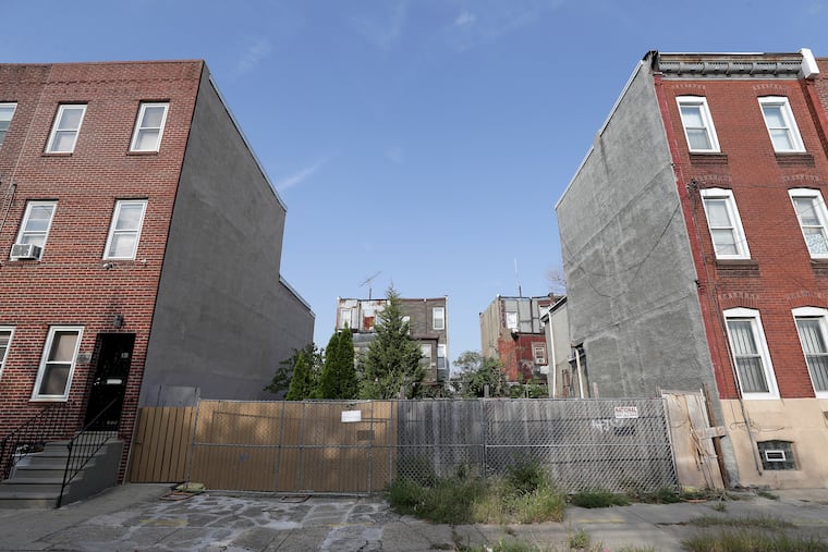 An overall view of two lots at 1834 and 1836 N 4th Street in Philadelphia, PA on September 23, 2019. These are properties that were acquired from estates of the dead. Unregulated and unlicensed entrepreneurs are scouring poor neighborhoods for heirs, paying them low-ball prices for their real estate and flipping it for gigantic profits.