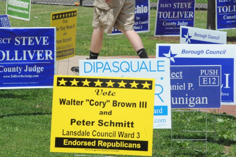 Primary election day in Pennsylvania Tuesday, May 21, 2013 as evidenced by campaign signs sprouting in front of the polling place at York Avenue Elementary School in Lansdale. CLEM MURRAY / Staff Photographer