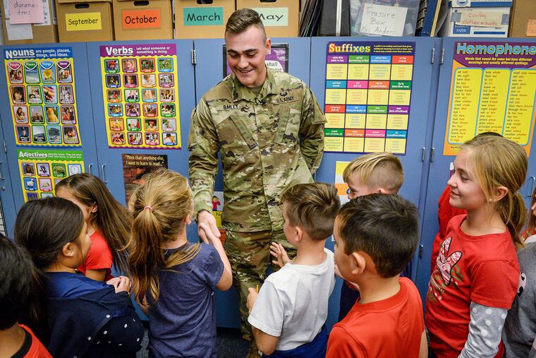U.S. Army Second Lt. Austin Bailey shakes hands with second graders in Carrie Anders' class at Dry Creek Elementary School in California in December.