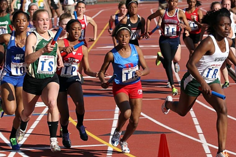 Runners in the high school girls 4x400 South Jersey Large Schools run
in the Penn Relays at Franklin Field on Thursday, April 25, 2013. (Yong Kim/Staff Photographer)