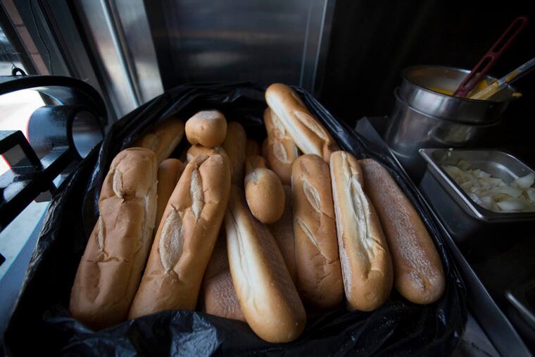 Fresh rolls next to the grill at Sumo Steaks. ( Colin Kerrigan / Philly.com )