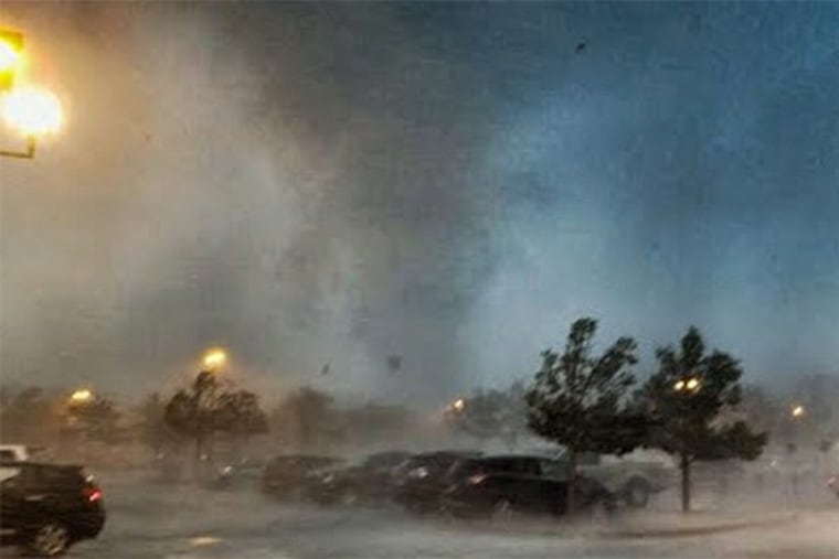 A tornado rips through the parking lot of a Home Depot on Route 9 in Howell, NJ on Saturday morning.