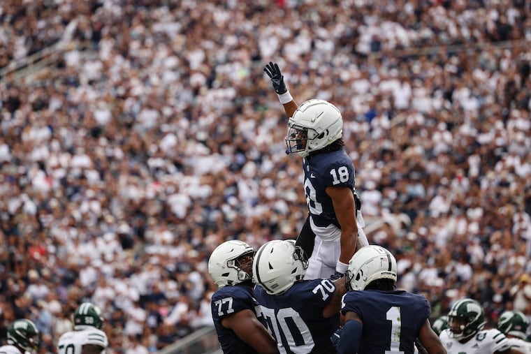 Omari Evans #18 of the Penn State Nittany Lions celebrates with teammates after scoring a touchdown against the Ohio Bobcats during the second half at Beaver Stadium on Sept. 10 in State College.