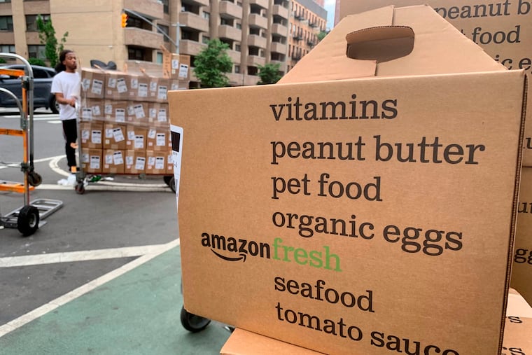 In this June 2019 photo, boxes of Amazon Fresh deliveries are unloaded in New York.