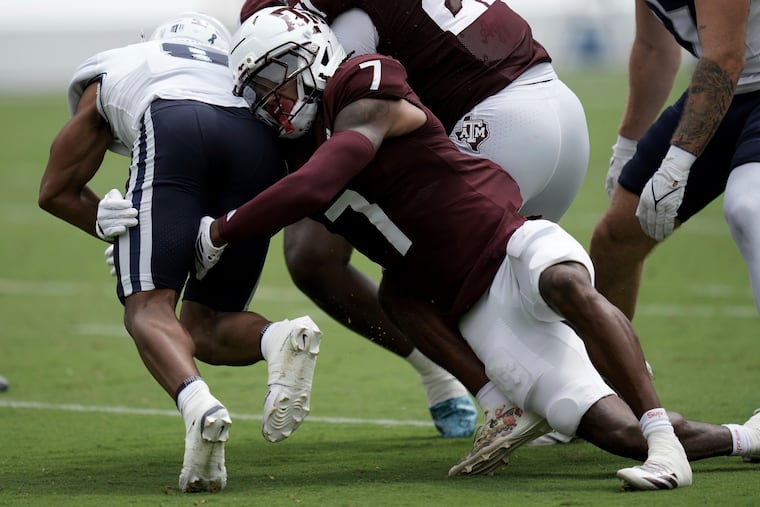 Texas A&M cornerback Tyreek Chappell tackles Utah State's Javen Jacobs on Sept. 6.