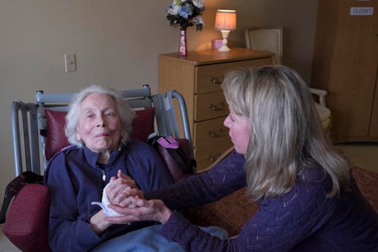 Carol Harrison visits with her mother, Grace Ward, at a Glenside nursing home. Harrison, who has seen other relatives stricken, wants to learn all she can about her options if dementia strikes her. ( ED HILLE / Staff Photographer )