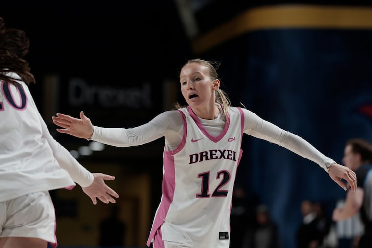 Drexel’s Grace O’Neill high-fives a teammate during a game against Elon.