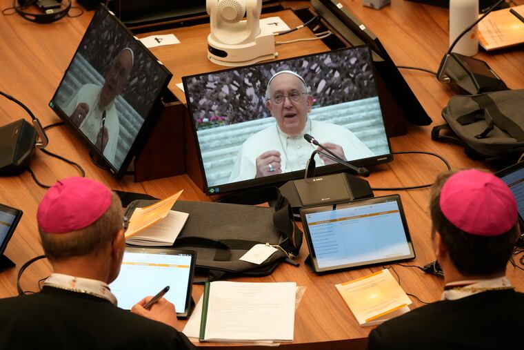 Participants in the opening session of the 16th General Assembly of the Synod of Bishops follow Pope Francis on monitors in the Paul VI Hall at The Vatican, Wednesday, Oct. 4, 2023. Pope Francis is convening a global gathering of bishops and laypeople to discuss the future of the Catholic Church, including some hot-button issues that have previously been considered off the table for discussion. Key agenda items include women's role in the church, welcoming LGBTQ+ Catholics, and how bishops exercise authority. For the first time, women and laypeople can vote on specific proposals alongside bishops.