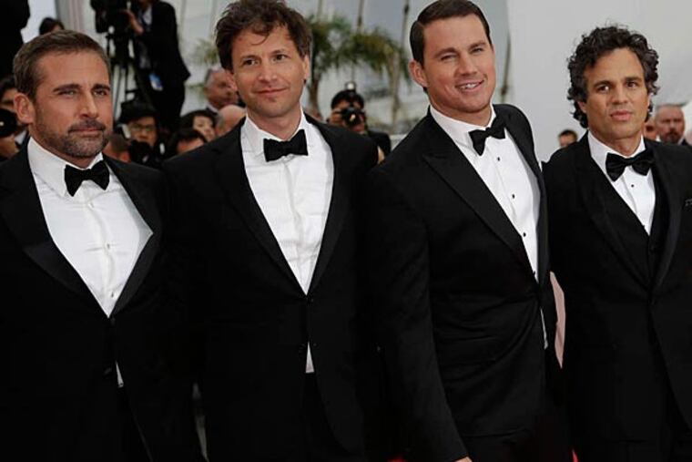Arriving for "Foxcatcher," Steve Carell, director Bennett Miller, Channing Tatum, and Mark Ruffalo stop on the red carpet at Cannes. (THIBAULT CAMUS/AP Images)