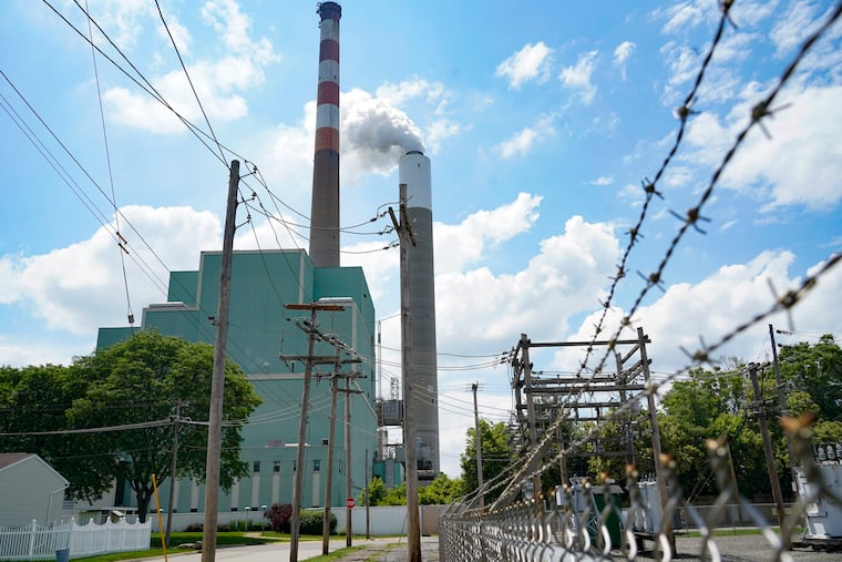 A flume of emissions flows from a stack at the Cheswick Generating Station, a coal-fired power plant, in Springdale, Pa., in 2021.