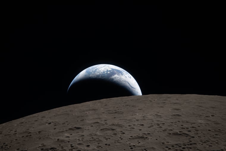 In this image provided by NASA, the Artemis II crew captured this view of an Earthset on Monday, April 6, 2026, as they flew around the Moon.