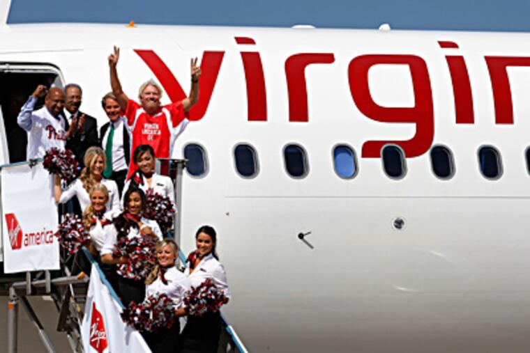 Among those heralding Virgin America’s arrival in Philadelphia this week were (from left) Mayor Nutter, Rep. Chaka Fattah, Virgin America president and CEO David Cush, and Virgin Group founder Richard Branson. MICHAEL S. WIRTZ / Staff Photographer