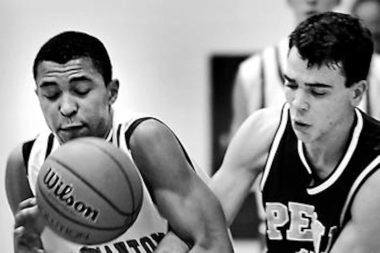 Germantown Academy's Cameron Ayers (left) battles Penn Charter's Mark Rhine. Ayers is the son of former 76ers head coach Randy Ayers.