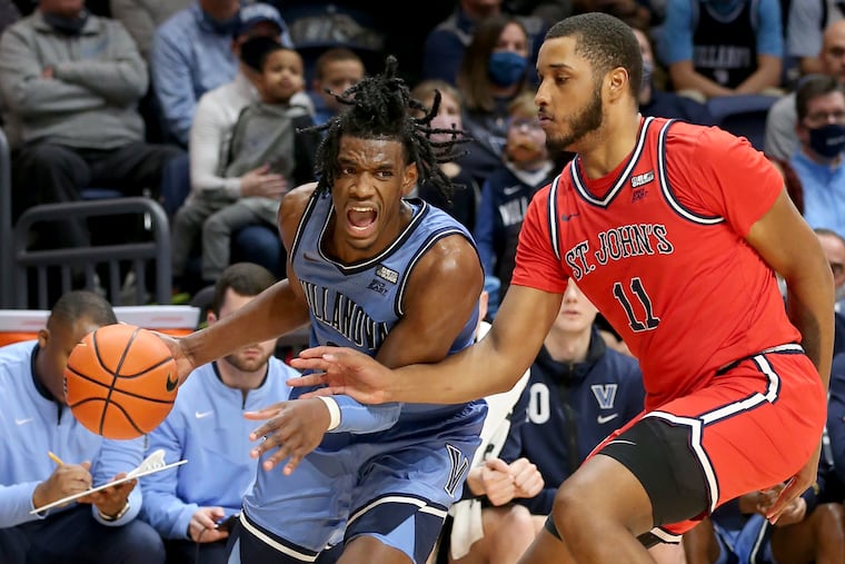 Brandon Slater (left) of Villanova drives the baseline against Joel Soriano of St. John's during the first half on Jan. 29, 2022 at Finneran Pavilion.