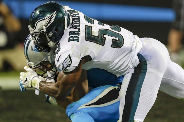 Eagles outside linebacker Nigel Bradham stops Carolina Panthers running back Christian McCaffrey during the third-quarter on Thursday, October 12, 2017 in Charlotte, NC. YONG KIM / Staff Photographer