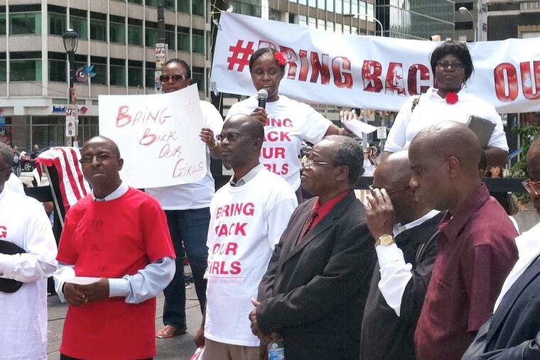 Pastor Funmi Obilana speaks during the rally, which marked a shift from social-media activism to a more traditional protest. "We say no to terrorism. We say no to Boko Haram," Obilana said.
