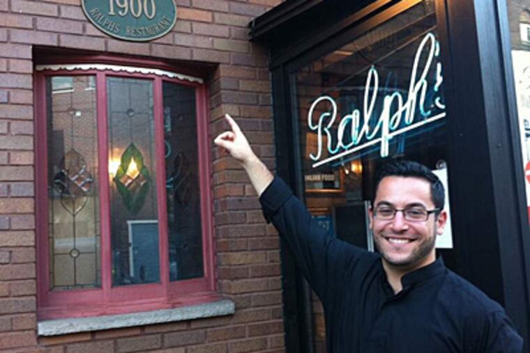 Ryan Rubino, fifth generation of the family that founded 112-year-old Ralph's Italian restaurant, says Ralph's is now the oldest Italian restaurant in the country. He points to the plaque commemorating its establishment in 1900. RONNIE POLANECZKY / DAILY NEWS STAFF