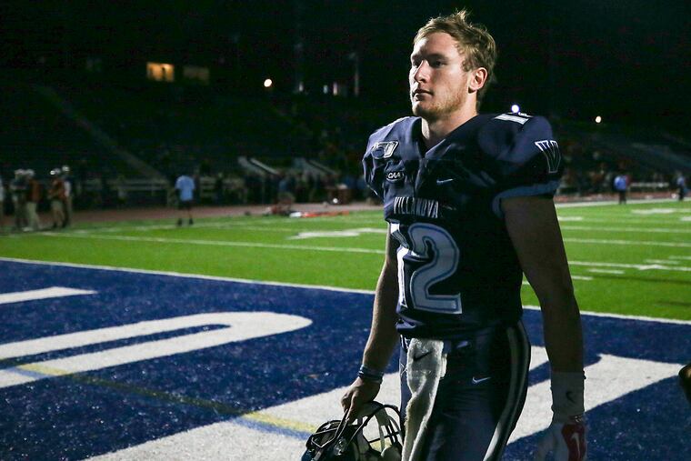 Villanova quarterback Daniel Smith walks off the field after Stony Brook stunned Villanova with a comeback win.