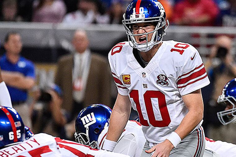 Eli Manning calls a play at the line against the Rams. (Jasen Vinlove/USA Today)