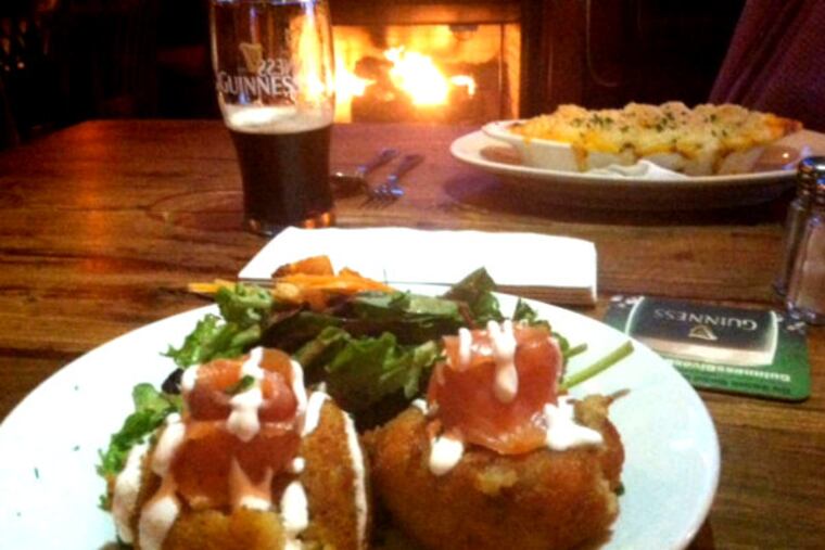 A plate of Colcannon, with a roaring fire (and half-drunk Guinness) in the background, at Black Sheep.