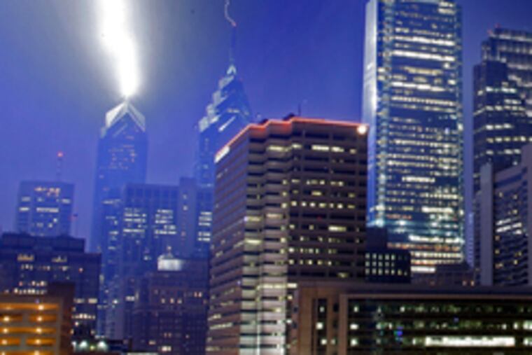 THE SPIRIT of Ben Franklin, still protecting the city: Franklin began making the first lightning rods in the 1750s to prevent electrical-storm damage. Here, lightning strikes the rods on Liberty One and Two during last night's storm.