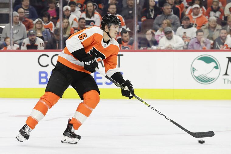 Flyers defenseman Travis Sanheim skating with the puck against the Avalanche.