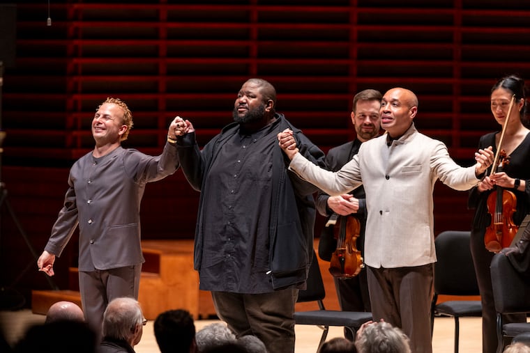 Yannick Nézet-Séguin, Philly-based composer Tyshawn Sorey, and Pianist Aaron Diehl, take a bow at Marian Anderson Hall on Friday.