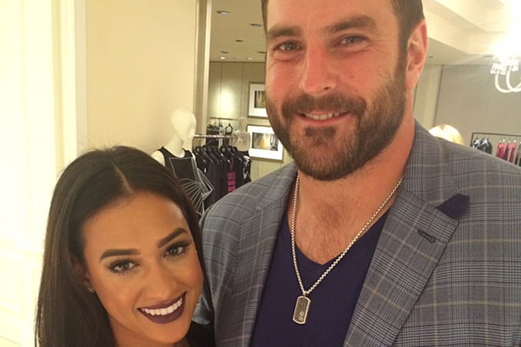 Eagle Todd Herremans with fiancé Elizabeth Dee at Saks Fifth Avenue on Oct. 2.