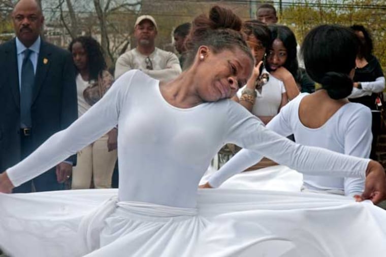 Overbrook High gathers to mourn Bernard Scott, killed Thursday across the street from the school on 4/16/13. Here, Ayana Bridges, 15, who was Bernard's cousin, cries as she dances with her members of the Overbrook HS Praise Dancers at the memorial. ( APRIL SAUL / Staff )